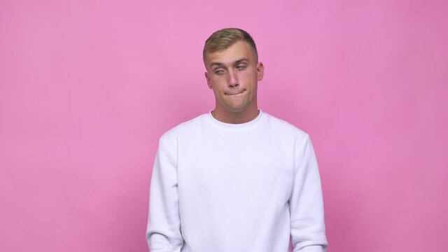 Young caucasian man confused, feels doubtful and unsure