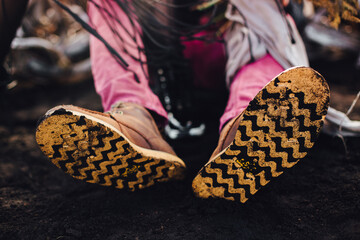 the soles of men's boots in black soil