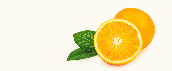 The orange is isolated. Whole fruit and half with leaves on a white background.