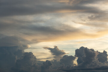 Beautiful sunset sky above clouds with dramatic light.