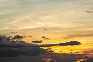 Beautiful sunset sky above clouds with dramatic light.