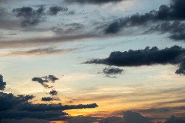 Beautiful sunset sky above clouds with dramatic light.