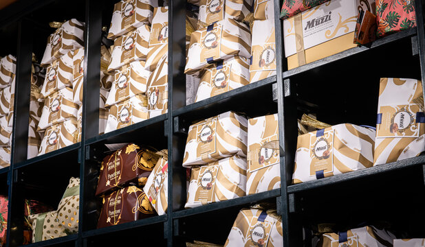 Many Christmas cackes for sale heap of italian traditional sweet panettone low angle view
