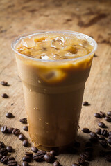 latte with ice on wooden table