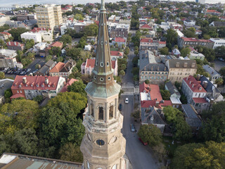 Aerial shot of the city of Charleston, South Carolina with the steeple of St Philips church in the...