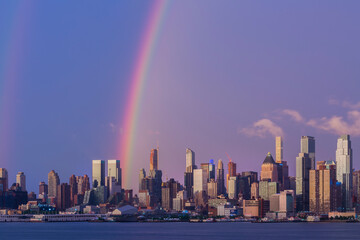 Fototapeta premium Rainbow at the golden hour above the city 2