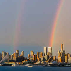Rainbow at the golden hour above the city