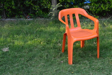 red chair on green grass