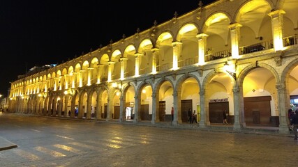 Fototapeta premium arches of arequipa square at night - plaza de armas south america