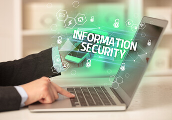 INFORMATION SECURITY inscription on laptop, internet security and data protection concept, blockchain and cybersecurity