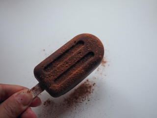 homemade chocolate ice cream lolly on a white background