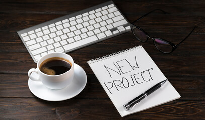 Open A Blank White Notebook, Pen And Coffee On The Desk