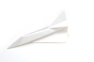 A landing paper plane on white background
