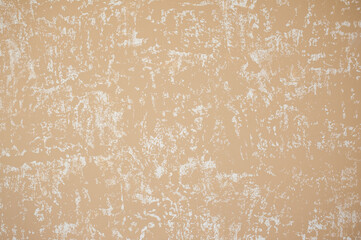 Preparing the wall in the apartment for Venetian decorative plaster with golden glittering paint. Background, abstraction. Apartment renovation concept.