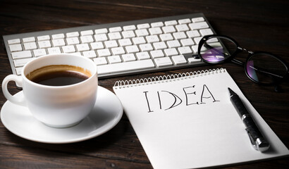 Open A Blank White Notebook, Pen And Coffee On The Desk