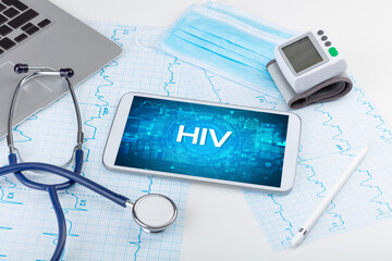 Close-up view of a tablet pc with HIV abbreviation, medical concept