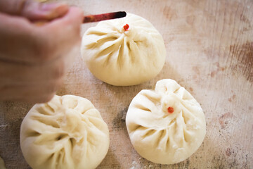 Image of making process of Chinese traditional food - baozi ( Chinese steamed buns )