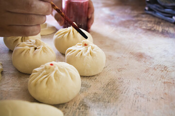 Image of making process of Chinese traditional food - baozi ( Chinese steamed buns )