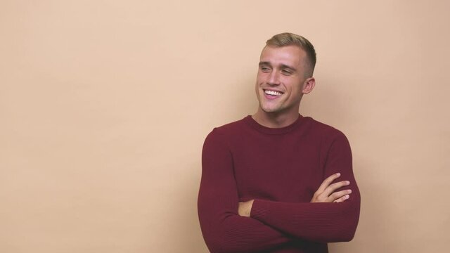 Young caucasian man smiling confident with crossed arms
