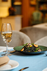Black spaghetti with seafood and saffron sauce