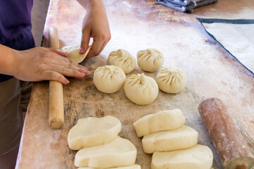 Image of making process of Chinese traditional food - baozi ( Chinese steamed buns ). Using a...
