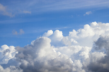 Naklejka na ściany i meble White cloud in blue sky. Rain later.