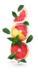 Grapefruits and green mint leaves on a white background. Falling citrus. Grapefruit