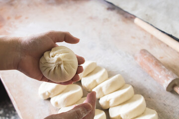Image of making process of Chinese traditional food - baozi ( Chinese steamed buns )