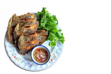 Deep-fried tilapia served with fish sauce, chili and onion mixed with lemon juice