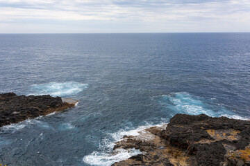 waves crashing on rocks