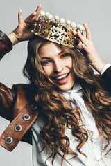 dynamic smiling woman in golden crown with pearls