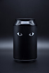 two drawn eyes on a black background. two cat eyes drawn on a black background on an aluminum can