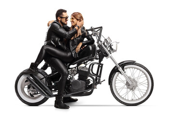 Fototapeta na wymiar Biker with a girlfriend sitting on a chopper motorbike