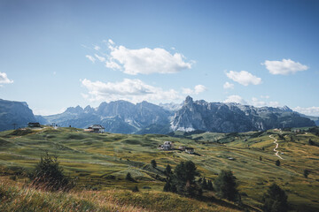 Summer scenery of Italian fields and mountains.