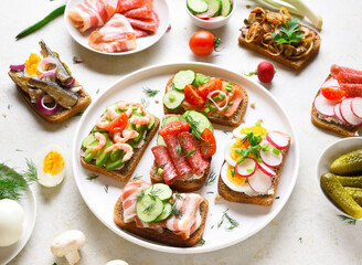 Open sandwiches with meat, vegetables, seafood