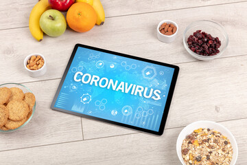 Healthy Tablet Pc compostion with CORONAVIRUS inscription, immune system boost concept