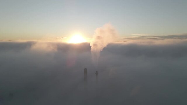  Drone shot over Bor&aring;s Sweden. Crossing the freeway, trees and a lake. 