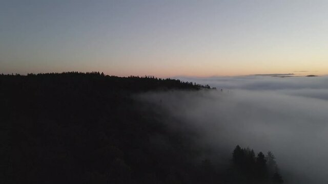 Drone shot over Bor&aring;s Sweden. Crossing the freeway, trees and a lake.