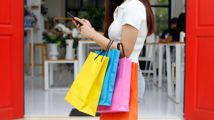 Woman in shopping. Happy woman with shopping bags enjoying in shopping. Consumerism, shopping, lifestyle concept