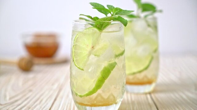 iced honey and lime soda with mint - refreshing drink
