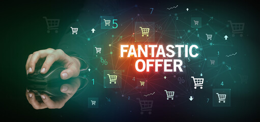 hand holding wireless peripheral with FANTASTIC OFFER inscription, online shopping concept