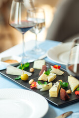 Assorted spanish cheese platter with red wine