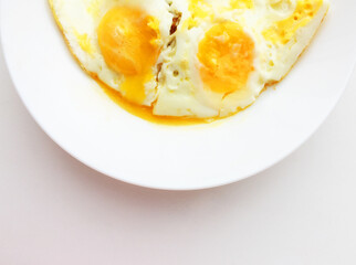 The eggs are smiling. eggs on a white plate
