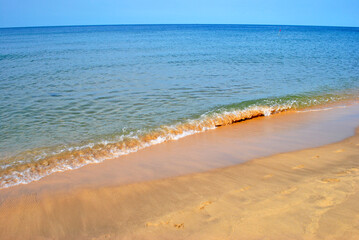 Coastal surf on the beach of a tropical island in Vietnam