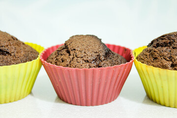 Baked muffins on a white table.Close -up