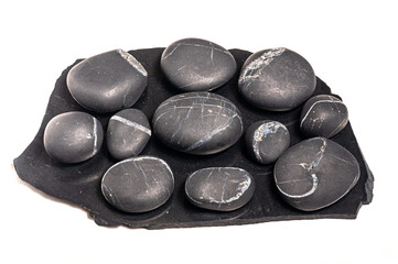 several shungite stones isolated on a white background