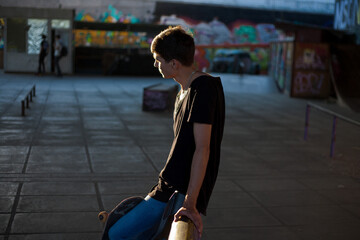 guy without legs rides a skateboard in a skate park