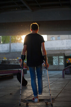 guy without legs rides a skateboard in a skate park