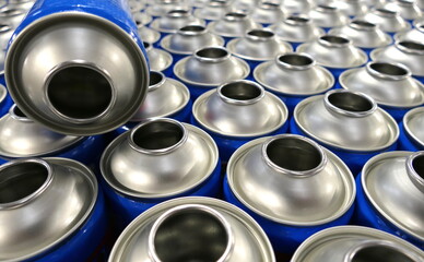 Blue empty aerosol steel cans 