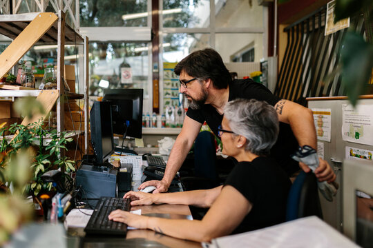 Couple working the greenhouse office